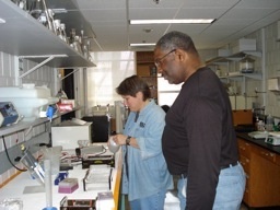 Two people standing in lab