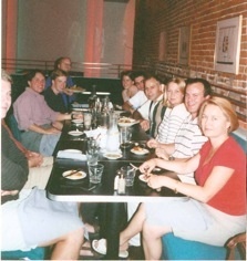 lab member sitting at restaurant table