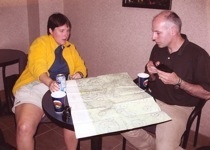 two lab members looking over map